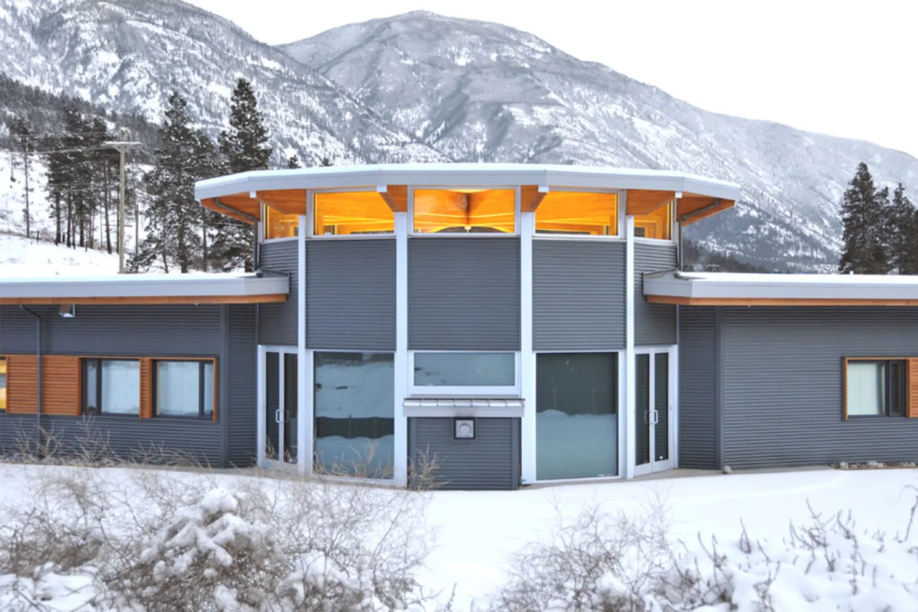 The centre in winter, its round clerestory drum set below the mountains above Lytton.